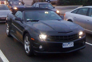 Illustration for article titled Camaro Convertible Snapped Still Sneaking Around Australia